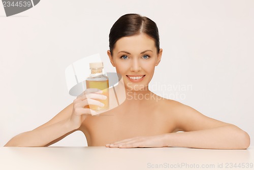 Image of woman with oil bottle
