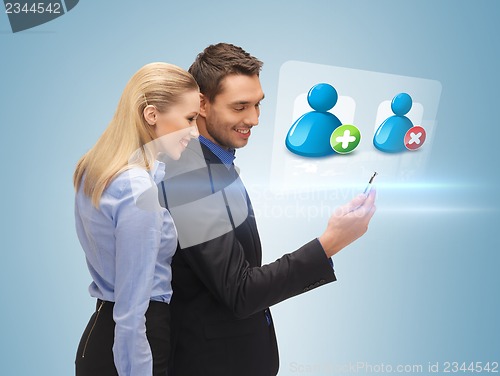 Image of man and woman reading sms