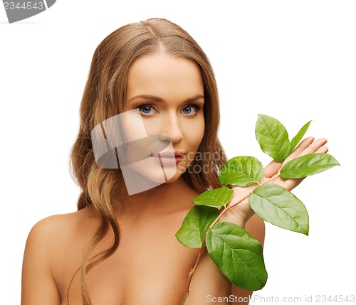 Image of woman with green leaf