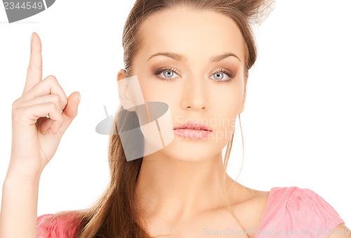 Image of beautiful woman with finger up