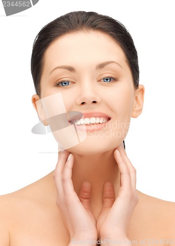 Image of face and hands of beautiful woman
