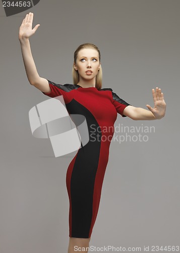 Image of woman working with something imaginary