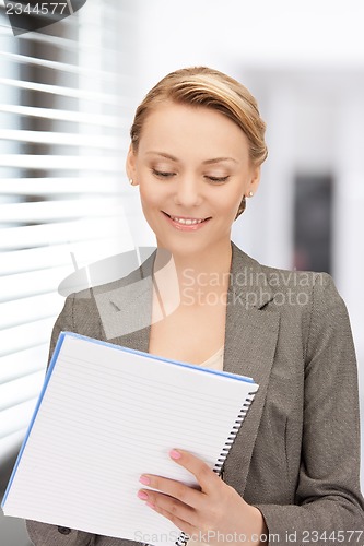 Image of happy woman with big notepad