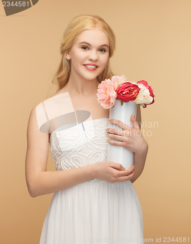 Image of woman with vase of flowers