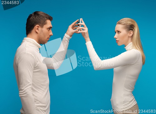 Image of man and woman with modern gadgets