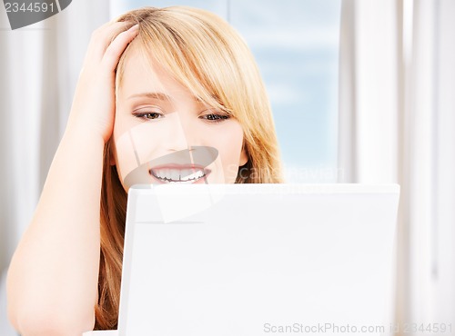 Image of teenage girl with laptop computer