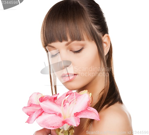 Image of lovely woman with lily flower