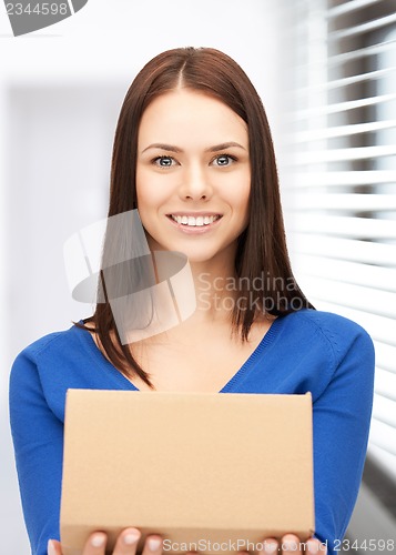 Image of attractive businesswoman with cardboard box