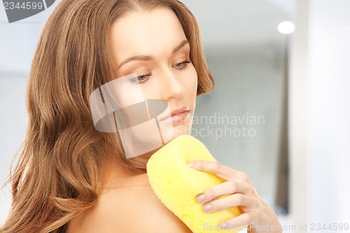 Image of beautiful woman with sponge