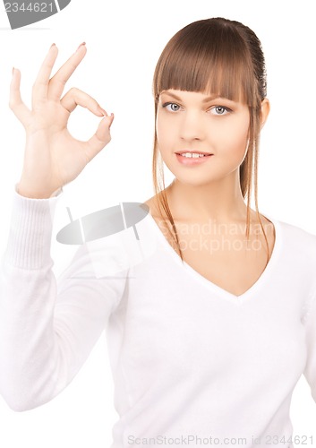 Image of young woman showing ok sign