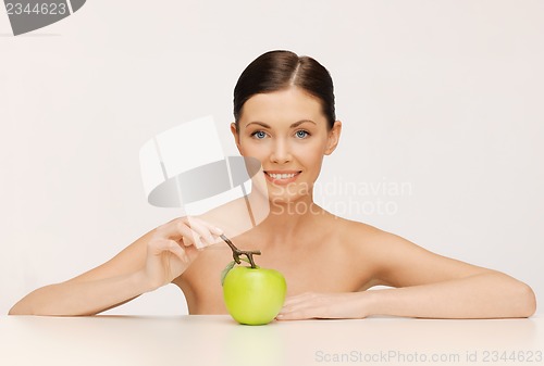 Image of woman with green apple