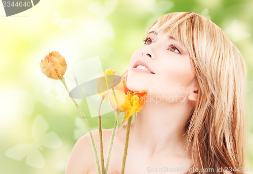 Image of lovely woman with red flowers and butterflies