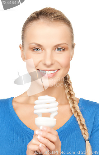 Image of woman with energy saving bulb