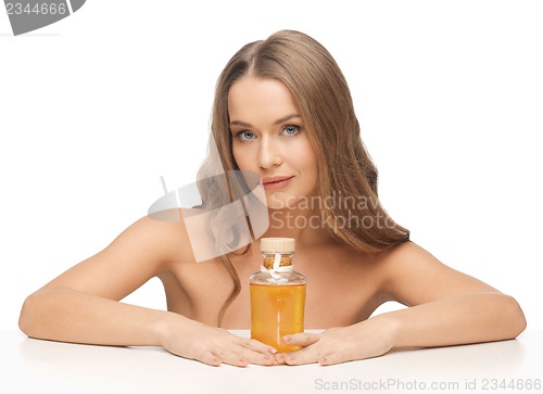 Image of woman with oil bottle