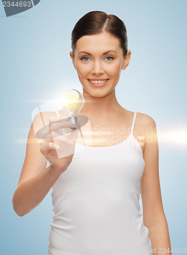 Image of woman with energy saving bulb