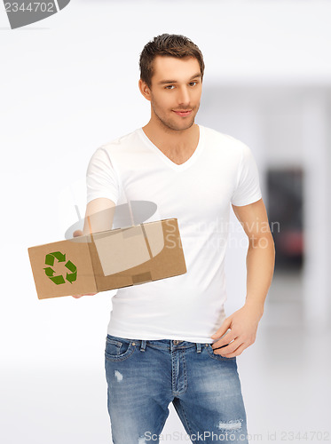 Image of handsome man with recyclable box