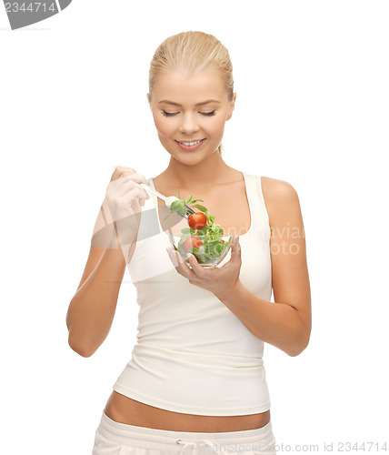 Image of healthy woman holding bowl with salad