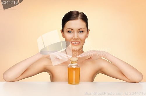Image of woman with oil bottle
