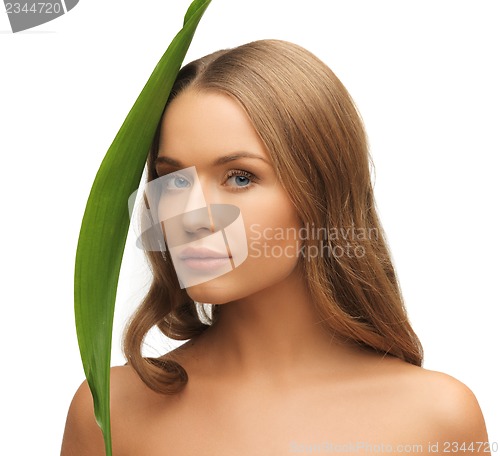 Image of woman with green leaf