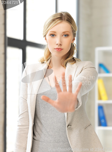 Image of woman making stop gesture