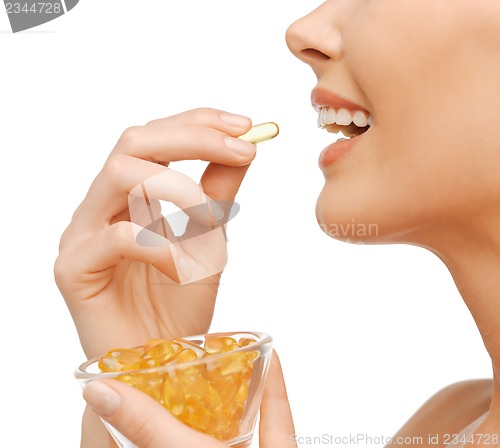 Image of woman with vitamins