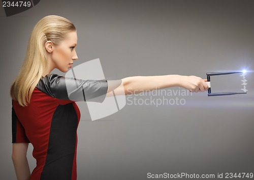 Image of woman with sci fi weapon