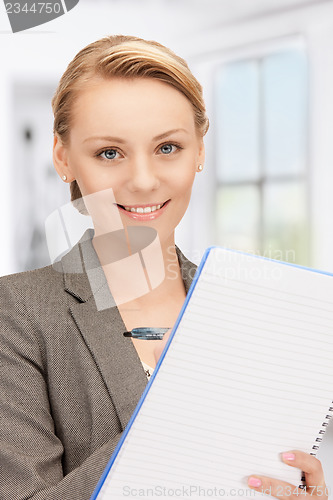 Image of happy woman with big notepad