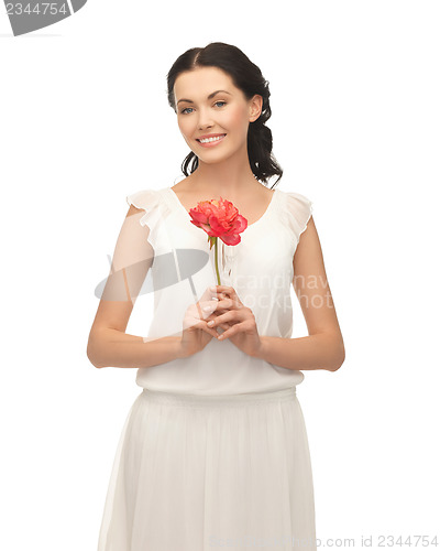 Image of young and beautiful woman with flower