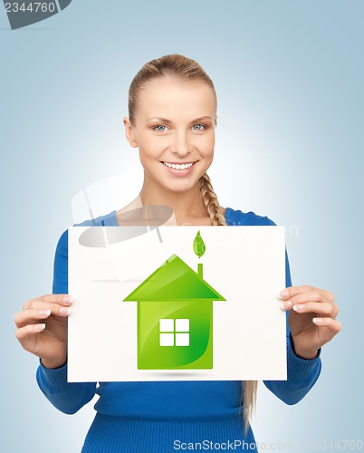 Image of woman with illustration of green eco house