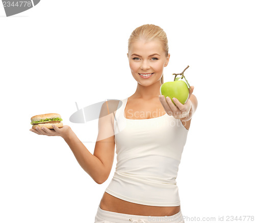 Image of woman with apple and hamburger