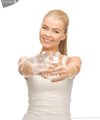 Image of young smiling woman with glass of water