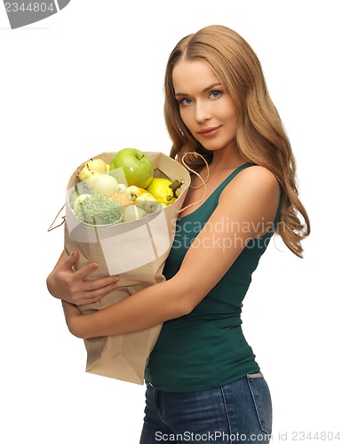 Image of woman with shopping bag full of fruits