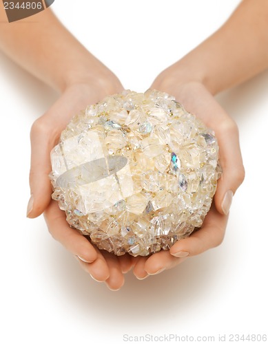 Image of woman hands holding bath ball