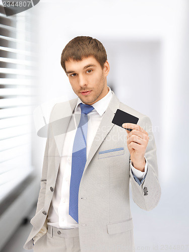 Image of businessman with credit card