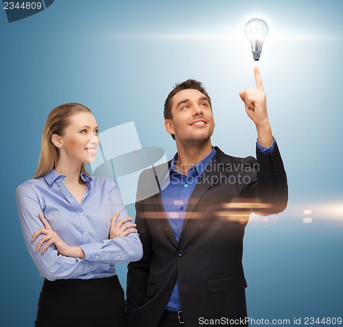 Image of man and woman with light bulb