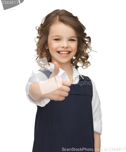 Image of pre-teen girl showing thumbs up