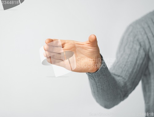 Image of man holding imaginary object