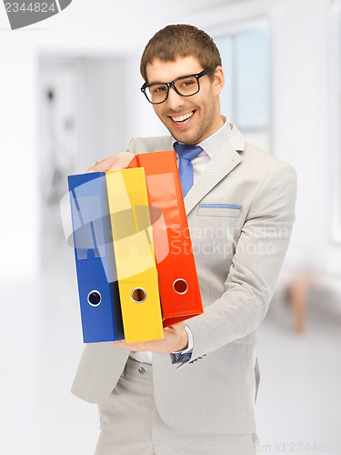 Image of man with folders