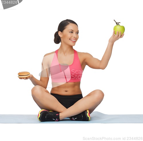 Image of woman with apple and hamburger