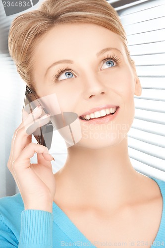 Image of businesswoman with cell phone calling