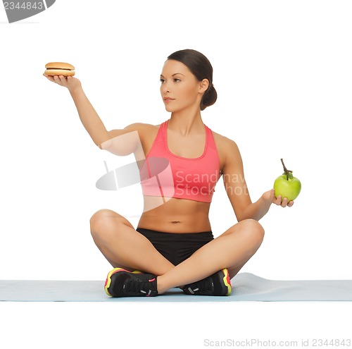 Image of woman with apple and hamburger