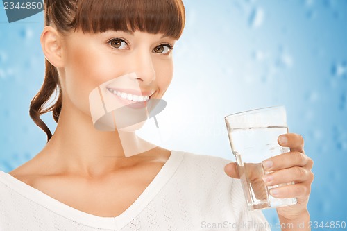 Image of young smiling woman with glass of water
