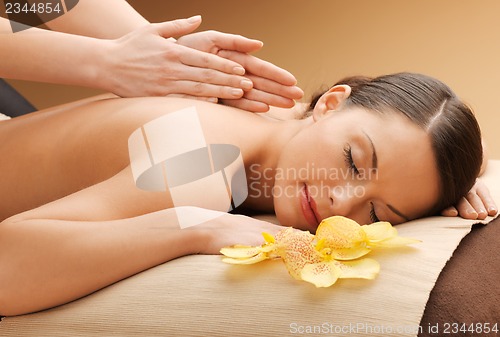 Image of beautiful woman in massage salon