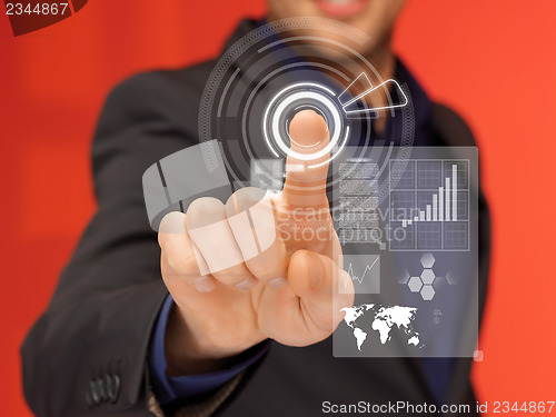 Image of handsome man in suit pressing virtual button