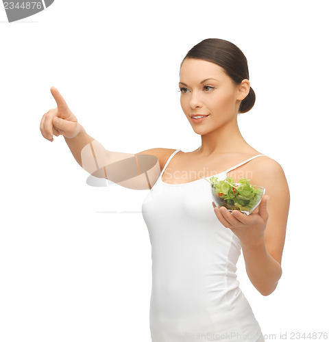 Image of healthy woman holding bowl with salad