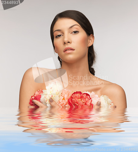 Image of relaxed woman with flowers