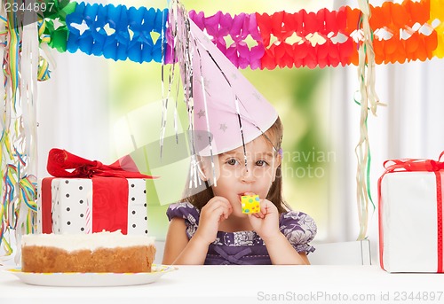 Image of litle girl with birthday cake