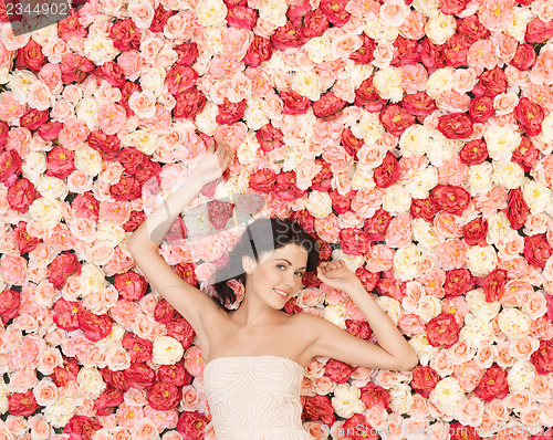 Image of young woman with background full of roses