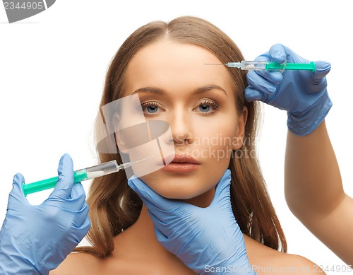 Image of woman face and beautician hands