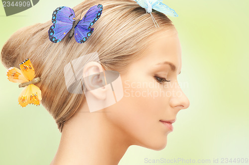 Image of woman with butterfly in hair